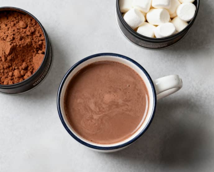 Artisan hot chocolate making kit with gourmet cocoa and marshmallows for a cozy treat.