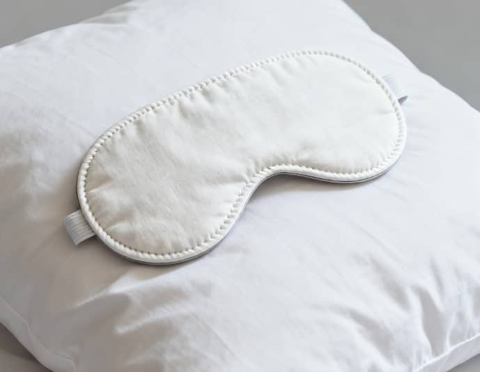 Plush weighted sleep mask using deep pressure to ease anxiety and promote deeper rest.