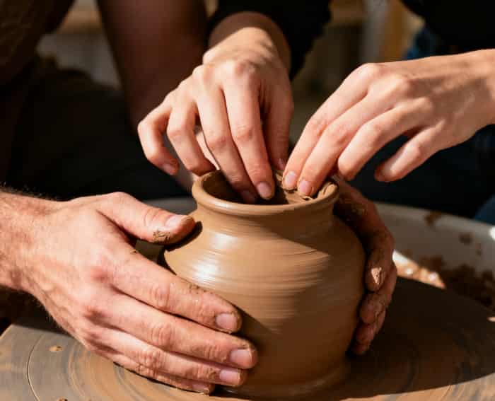 Couple enjoying a fun pottery workshop experience together