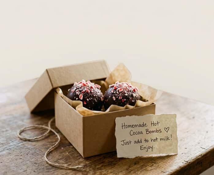 Homemade peppermint hot cocoa bombs in gift box