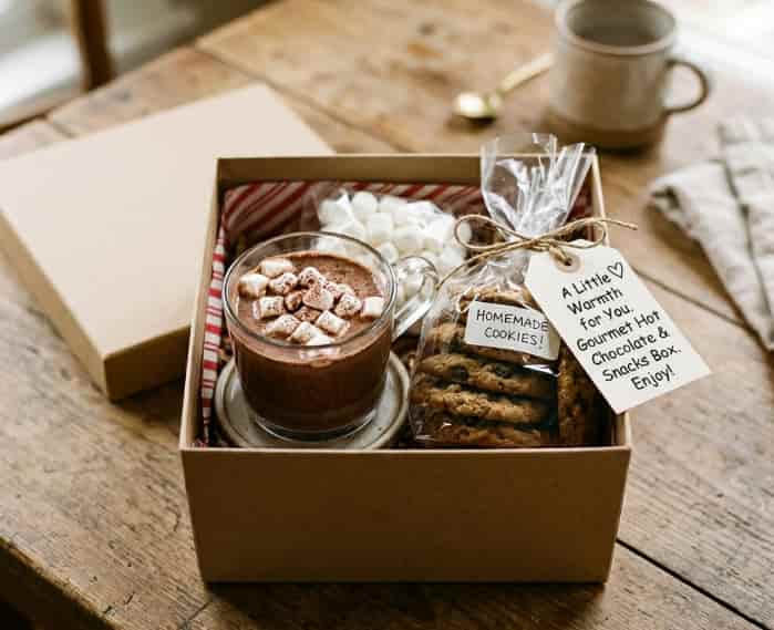 Gourmet hot chocolate and snacks gift box with marshmallows and cookies