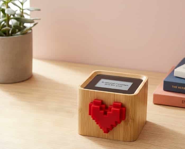 Lovebox Spinning Heart Messenger on a wooden desk