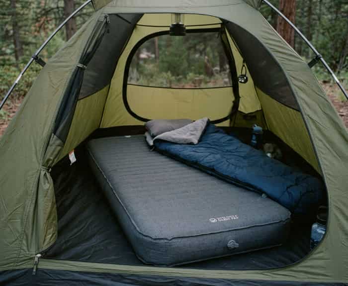Silent extra-thick sleeping pad laid inside a camping tent