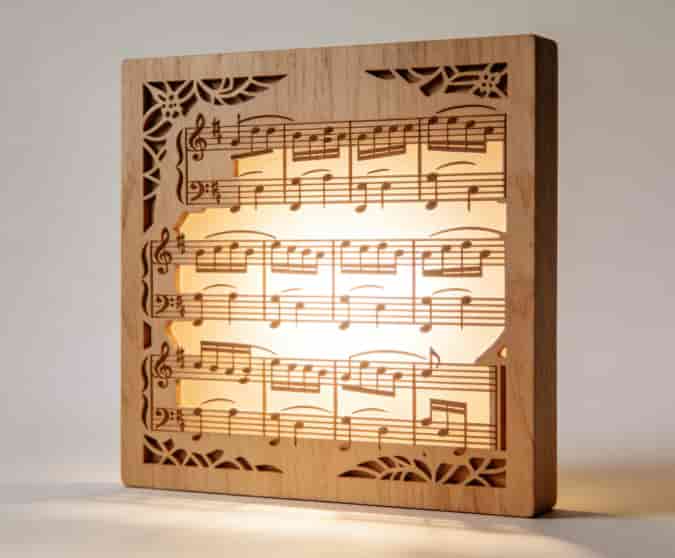 Laser-cut wood song art with backlight