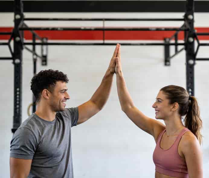 Couples doing yoga together in studio