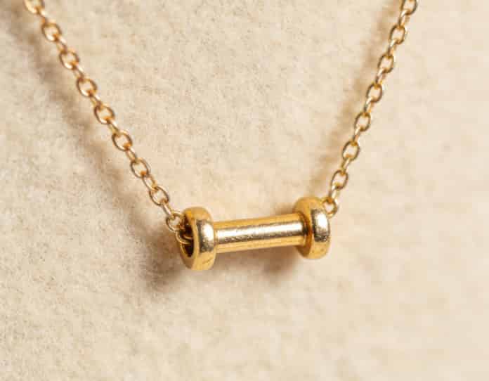 Delicate necklace with barbell charm