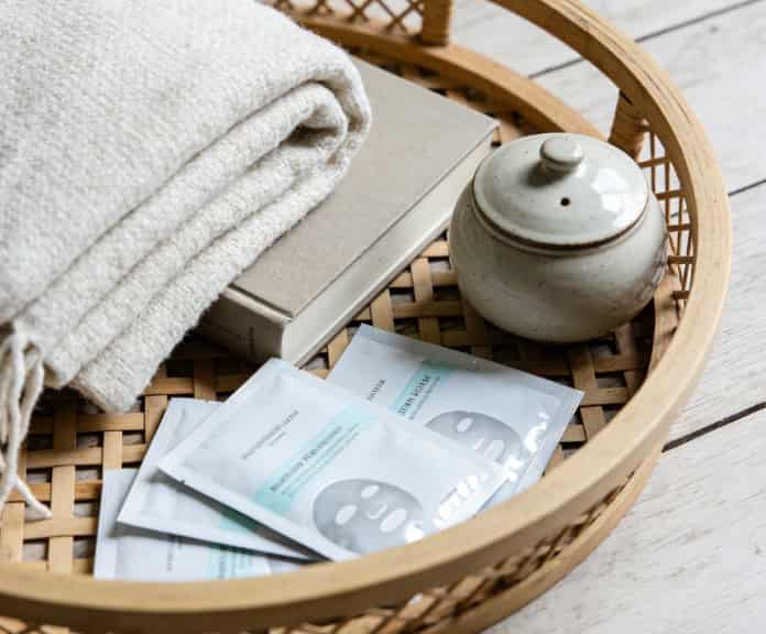 Relaxation gift basket with blanket and book