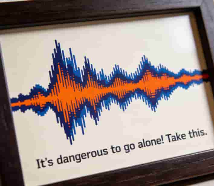 Framed soundwave art print of a video game quote with the waveform in a matching color palette