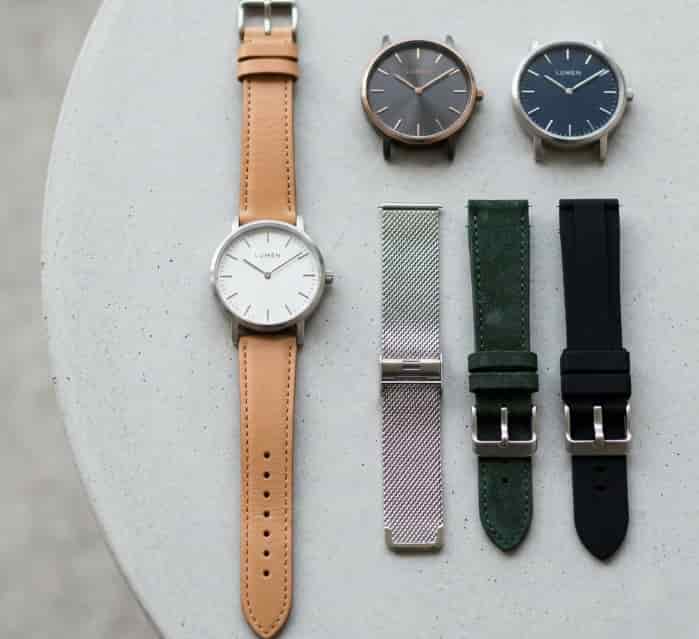 Minimalist watch with swappable faces and interchangeable straps