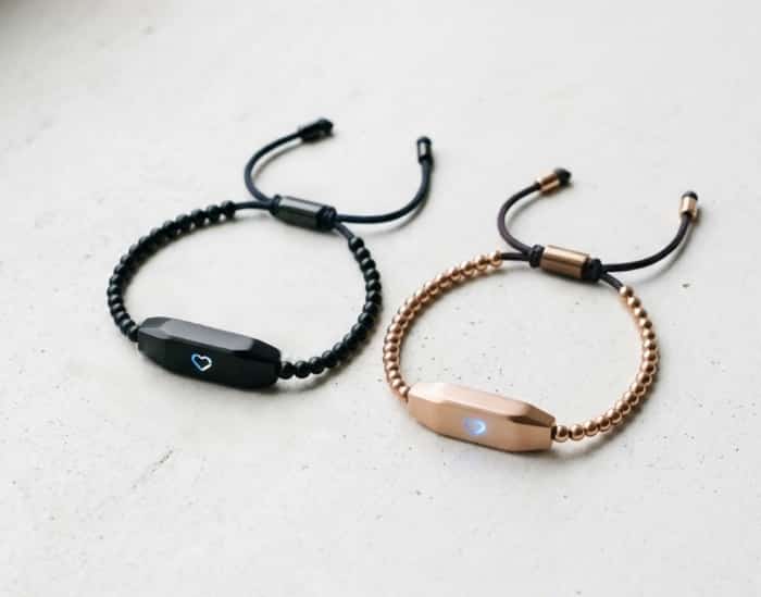 Pair of bracelets that vibrate when touched for long-distance connection
