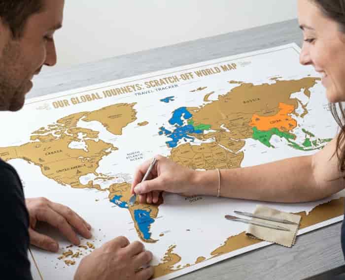 Gold foil scratch-off world map for tracking travels together